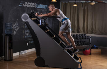 Fitness programming man using jacobs ladder limited use column