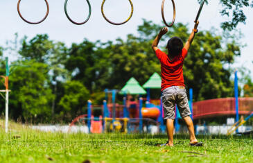 Wellness and community programming child playing playground unsplash stock column