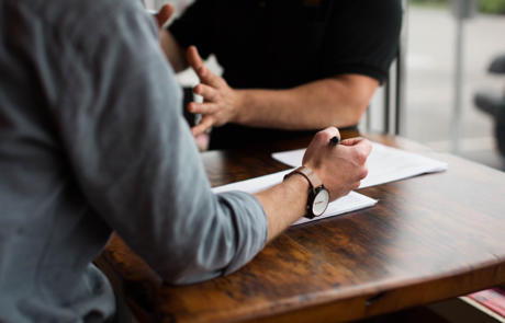 Staffing Men Having A Discussion Column