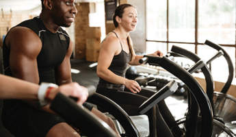 4 Reasons to Keep Going to the Gym During an Outbreak happy people equipment listing image